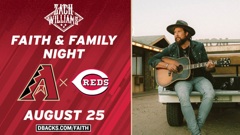 This is a picture of Zach Williams playing guitar on Faith and Family Night at Chase Field
